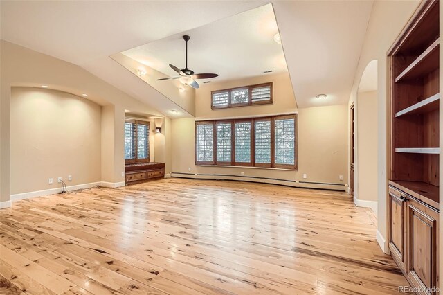 unfurnished living room with a baseboard radiator, ceiling fan, arched walkways, light wood finished floors, and baseboards