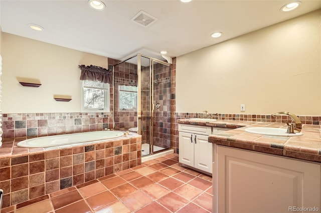 full bath featuring recessed lighting, visible vents, vanity, a bath, and a stall shower