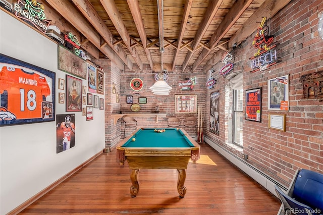 game room with wooden ceiling, baseboard heating, billiards, brick wall, and hardwood / wood-style flooring