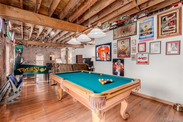 recreation room featuring pool table, wood-type flooring, brick wall, and beamed ceiling