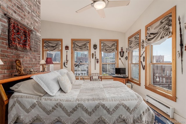 bedroom featuring lofted ceiling, ceiling fan, and a baseboard radiator