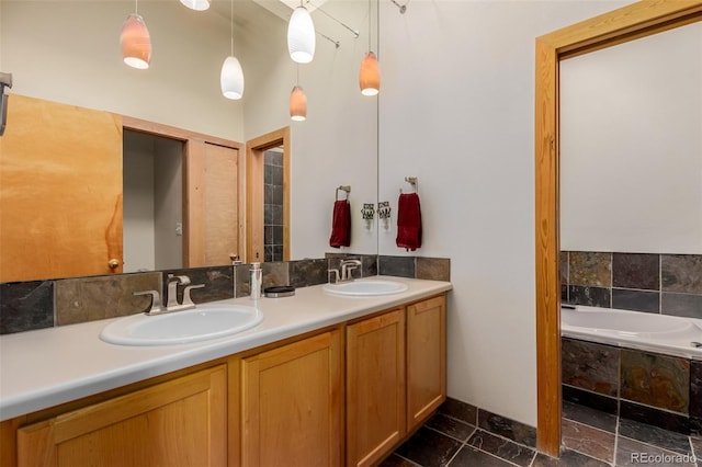 bathroom with a relaxing tiled tub and vanity