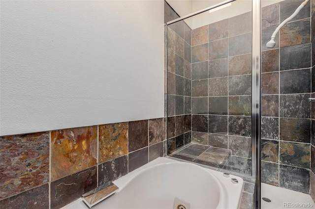 bathroom with separate shower and tub