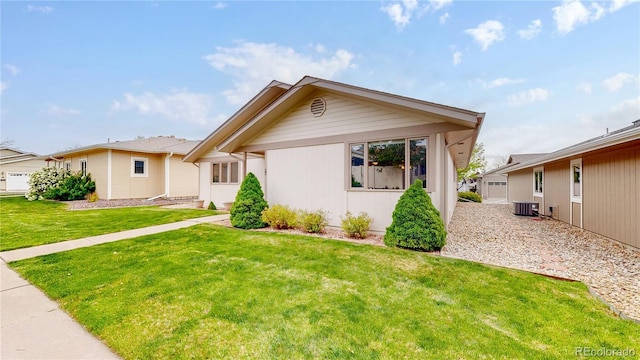 23 Carla Way, Broomfield, CO 80020 - ranch-style home with cooling unit and a front lawn
