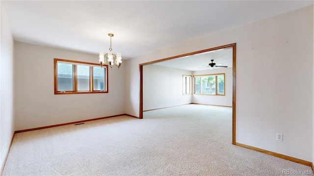 23 Carla Way, Broomfield, CO 80020 - empty room with healthy amount of natural light, carpet flooring, and a chandelier