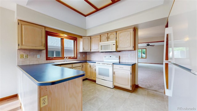 23 Carla Way, Broomfield, CO 80020 - kitchen featuring white appliances, a sink, a ceiling fan, a peninsula, and dark countertops