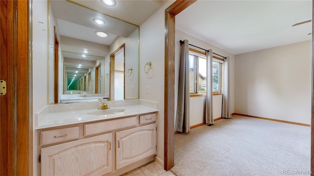 23 Carla Way, Broomfield, CO 80020 - bathroom featuring baseboards, vanity, and recessed lighting