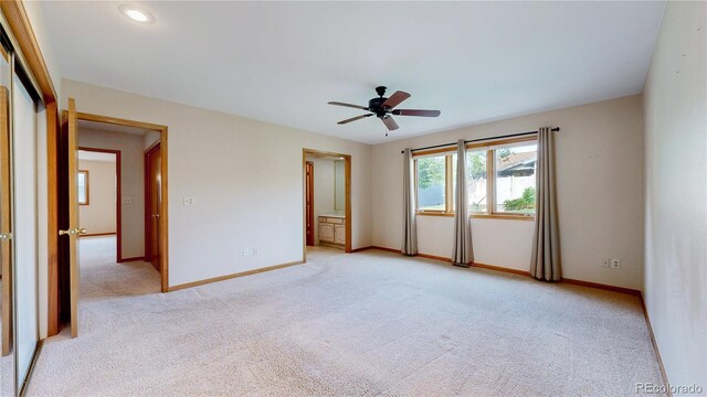 23 Carla Way, Broomfield, CO 80020 - unfurnished bedroom with light colored carpet, baseboards, ensuite bathroom, recessed lighting, and ceiling fan