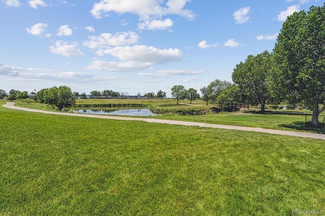 12059 E Hoye Dr, Aurora, CO 80012 - view of home's community featuring a water view and a lawn