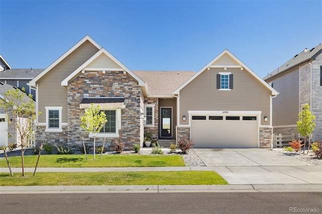 craftsman-style house featuring a garage and a front lawn