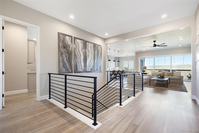 hallway with light hardwood / wood-style flooring