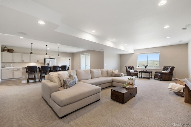 living room with light colored carpet