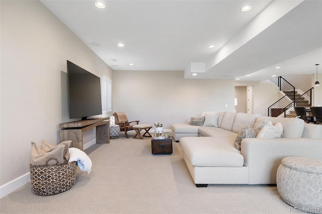 carpeted living room featuring recessed lighting, baseboards, and stairs