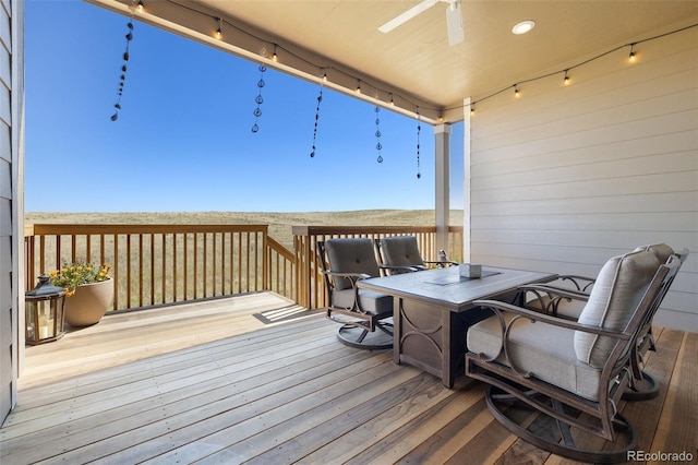 wooden terrace with a ceiling fan