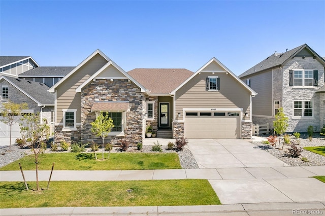 craftsman inspired home featuring a garage and a front yard