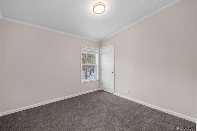 empty room with vaulted ceiling, crown molding, and dark carpet