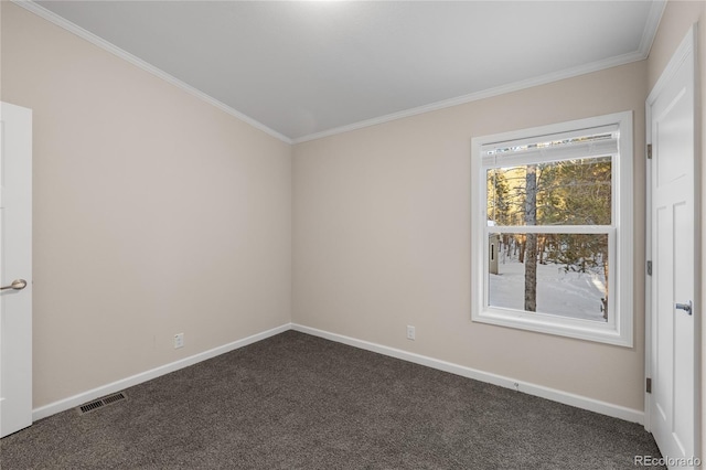 carpeted spare room featuring crown molding