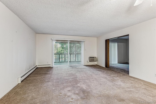 unfurnished room featuring a baseboard radiator, a textured ceiling, a wall mounted AC, and carpet floors