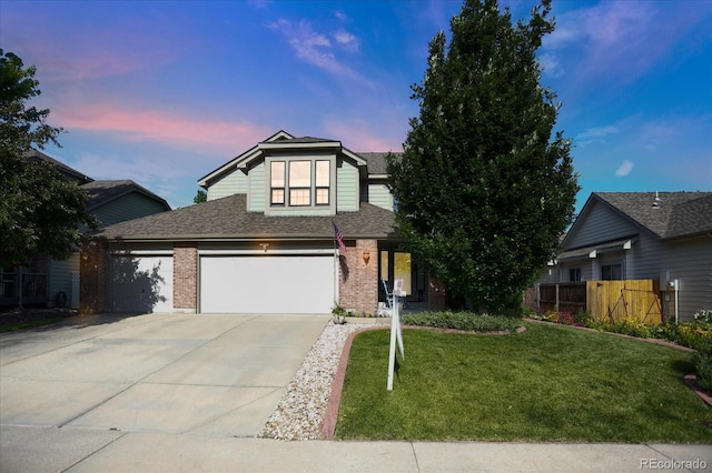 6112 Alkire Ct, Arvada, CO 80004 - traditional-style house featuring driveway, brick siding, roof with shingles, and an attached garage