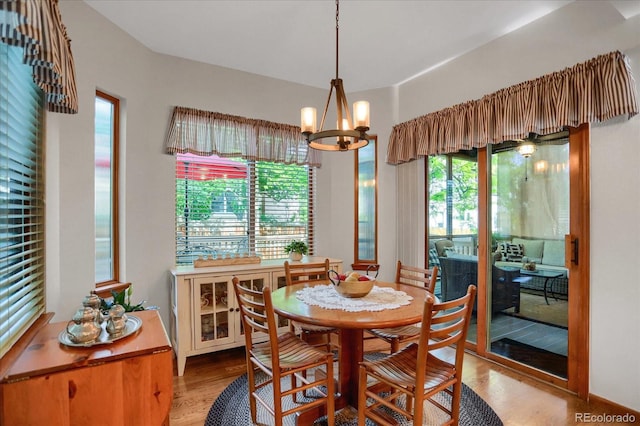 6112 Alkire Ct, Arvada, CO 80004 - dining space with wood finished floors and a chandelier