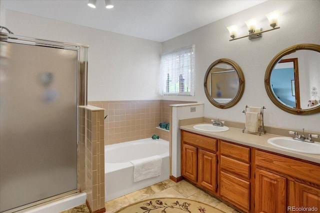 6112 Alkire Ct, Arvada, CO 80004 - full bathroom with a shower stall, a bath, double vanity, and tile patterned flooring