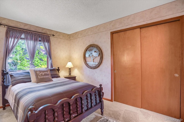 6112 Alkire Ct, Arvada, CO 80004 - bedroom with light carpet, a textured ceiling, and a closet