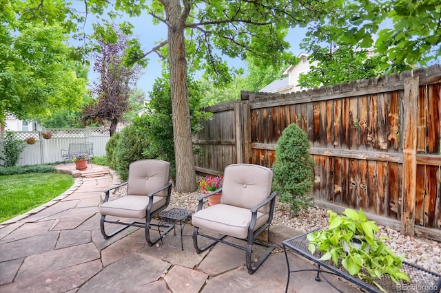 6112 Alkire Ct, Arvada, CO 80004 - fenced backyard featuring a patio area