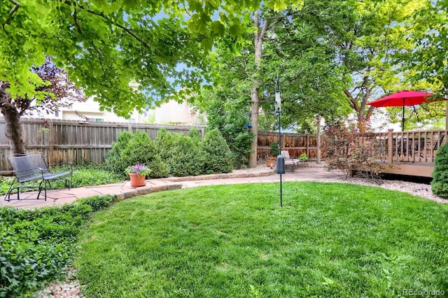 6112 Alkire Ct, Arvada, CO 80004 - fenced backyard featuring a patio area and a wooden deck