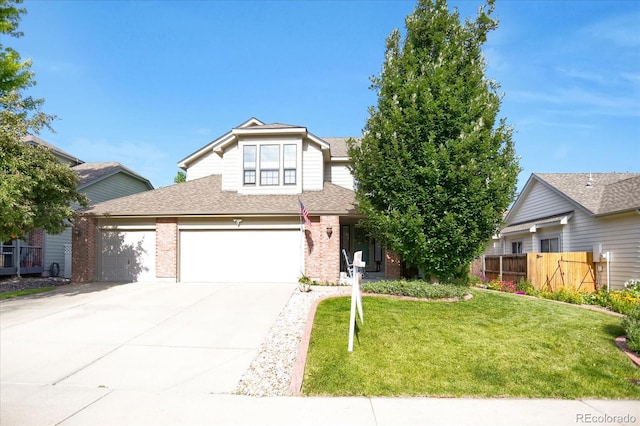6112 Alkire Ct, Arvada, CO 80004 - view of front of home featuring brick siding, driveway, roof with shingles, and a garage