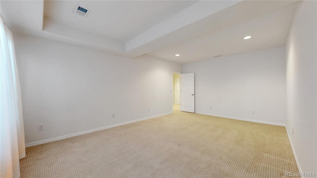 unfurnished room featuring light carpet, recessed lighting, visible vents, and baseboards