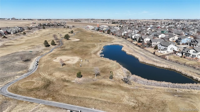 bird's eye view featuring a water view and a residential view