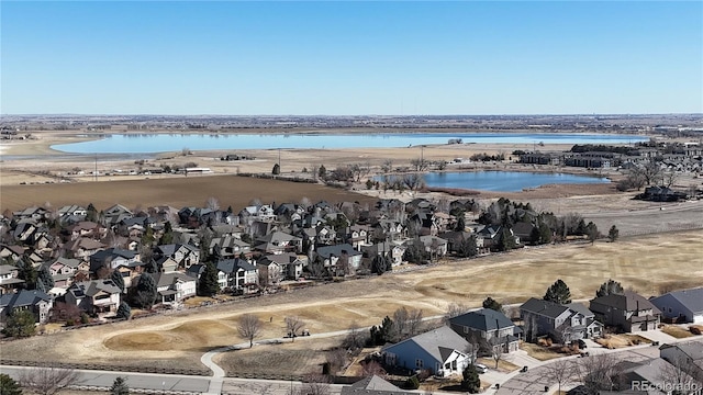 bird's eye view featuring a residential view and a water view