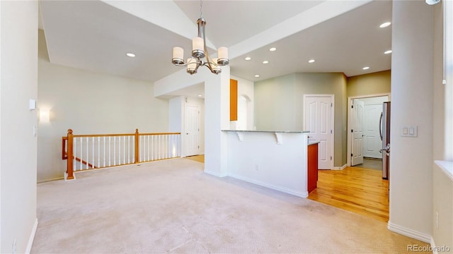 2238 Calais Dr Unit B, Longmont, CO 80504 - kitchen with an inviting chandelier, recessed lighting, baseboards, and light carpet
