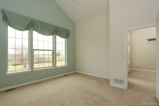 2238 Calais Dr Unit B, Longmont, CO 80504 - empty room featuring baseboards, carpet, vaulted ceiling, and visible vents