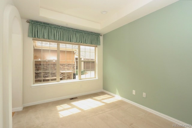 2238 Calais Dr Unit B, Longmont, CO 80504 - unfurnished room featuring carpet flooring, baseboards, visible vents, and a tray ceiling