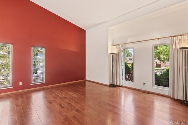 unfurnished room featuring hardwood / wood-style flooring