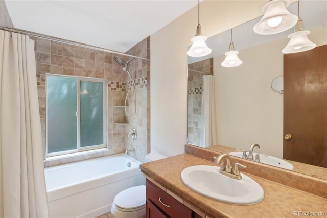 full bathroom with shower / tub combo with curtain, vanity, and toilet