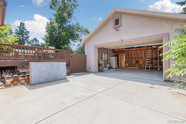 view of side of property with a wooden deck