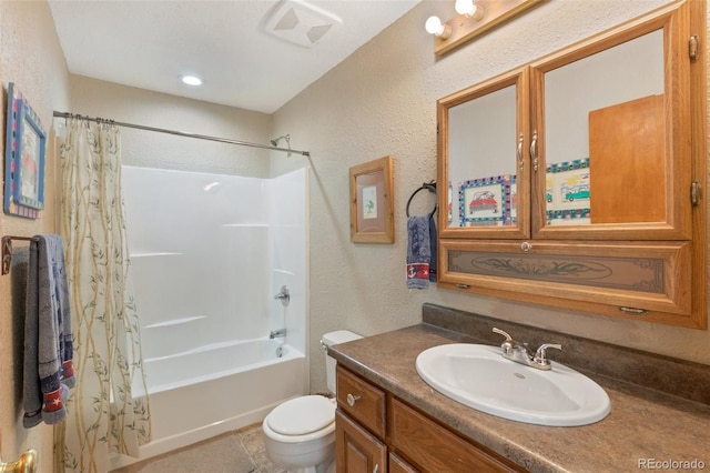 full bathroom with shower / tub combo with curtain, tile patterned flooring, vanity, and toilet