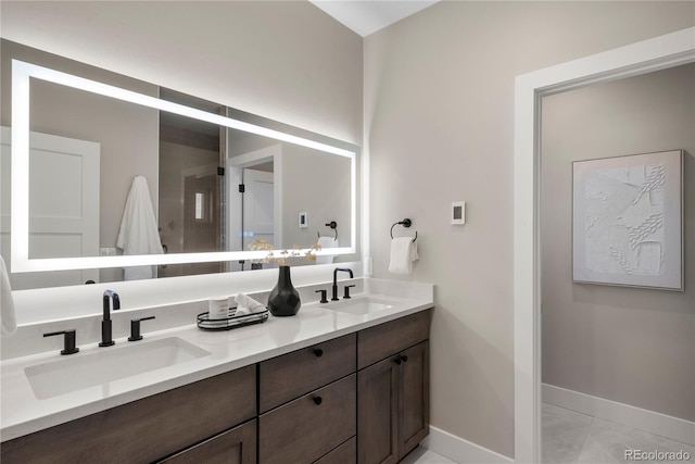 bathroom with tile patterned flooring and vanity