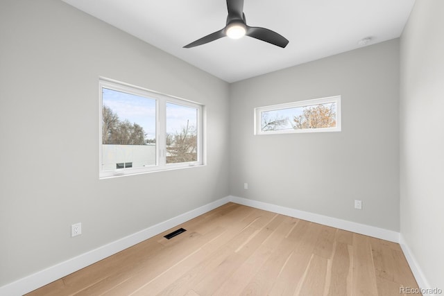 unfurnished room with light hardwood / wood-style flooring and ceiling fan