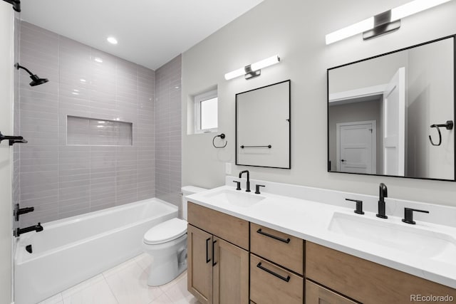 full bathroom with vanity, tiled shower / bath, toilet, and tile patterned floors