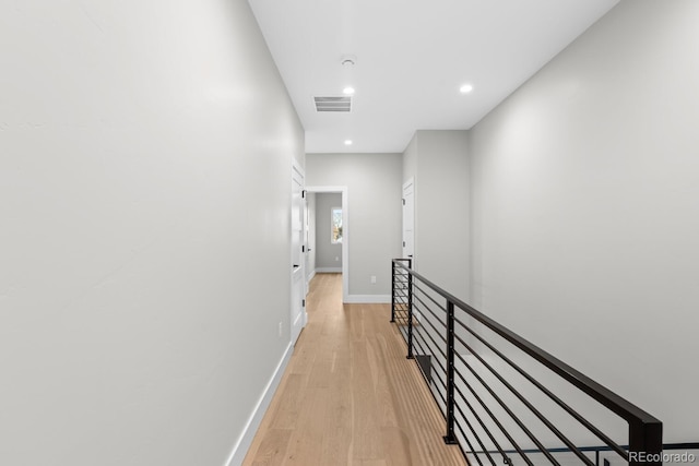 corridor with light wood-type flooring