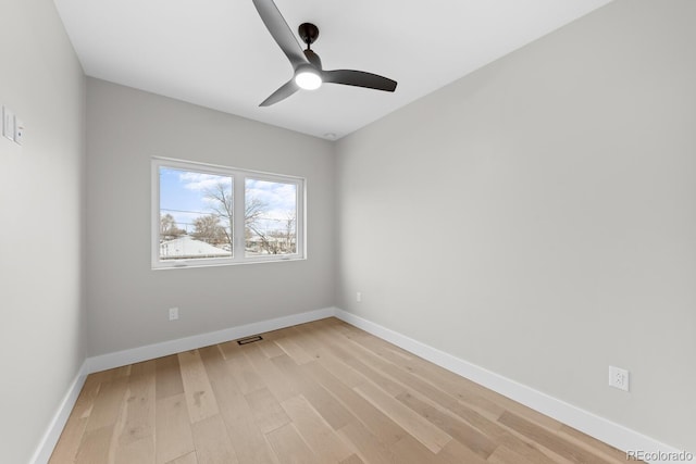 unfurnished room with ceiling fan and light hardwood / wood-style floors