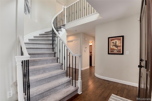 11056 W Rowland Ave, Littleton, CO 80127 - stairs with baseboards and wood finished floors