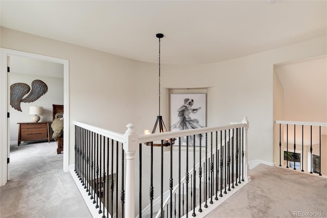 11056 W Rowland Ave, Littleton, CO 80127 - hallway with an upstairs landing, carpet, and baseboards