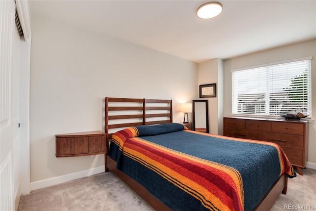 11056 W Rowland Ave, Littleton, CO 80127 - bedroom featuring light colored carpet and baseboards