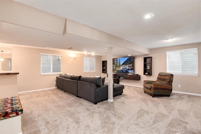 11056 W Rowland Ave, Littleton, CO 80127 - living room featuring carpet floors, baseboards, a textured ceiling, and recessed lighting