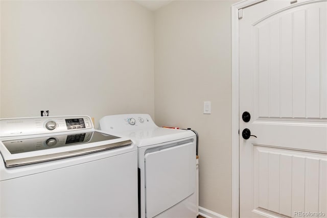 11056 W Rowland Ave, Littleton, CO 80127 - washroom featuring washing machine and clothes dryer