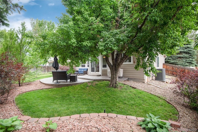 11056 W Rowland Ave, Littleton, CO 80127 - view of yard with an outdoor living space, central AC, and a patio area
